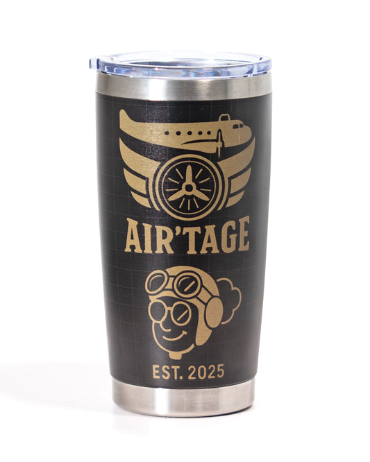 Black tumbler with gold 'AIR'TAGE' branding and airplane design on a white background